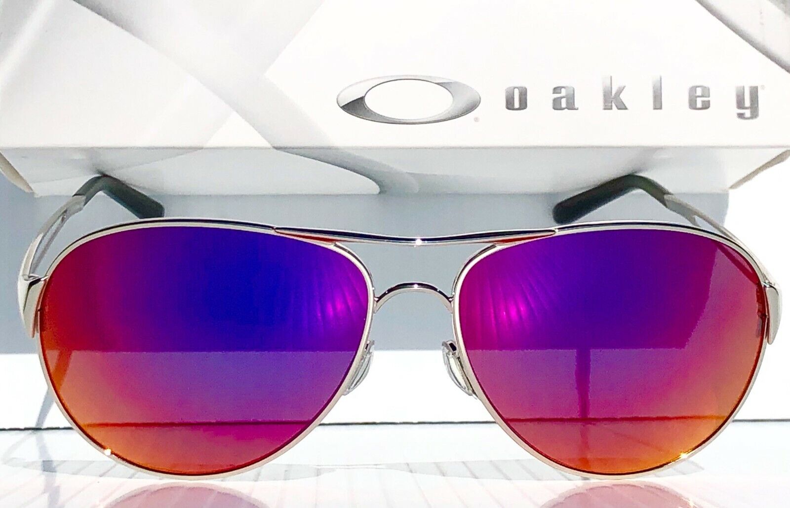 Oakley CAVEAT in Silver Frame with POLARIZED Galaxy Magenta Lens Sungl SunglassOne