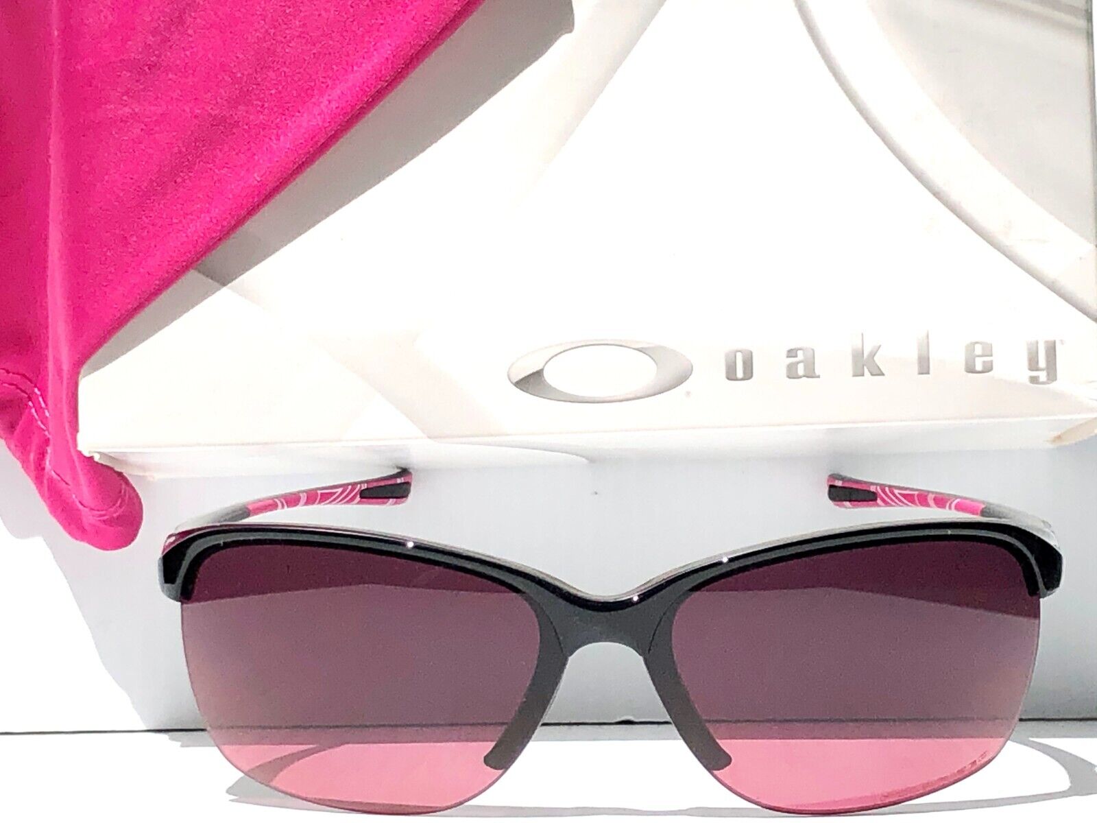 Oakley Women's Unstoppable Polarized Sunglasses, Black Shiny/pink Gradient Polar